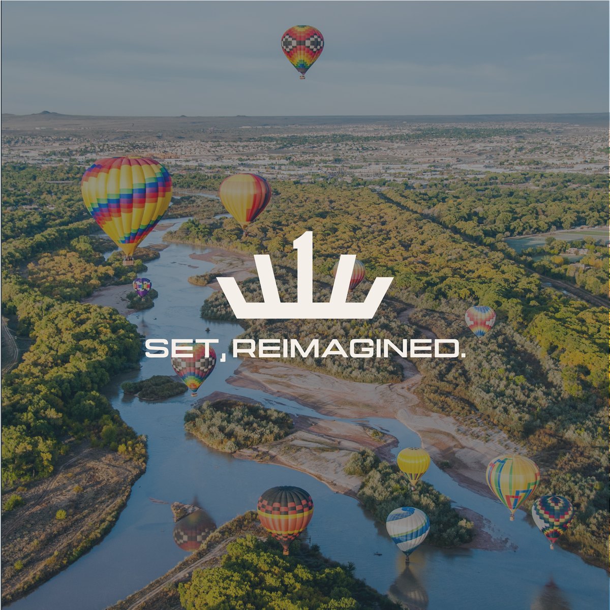 Reveal post with the new crown logo over hot air balloons above a river, reading SET, Reimagined.