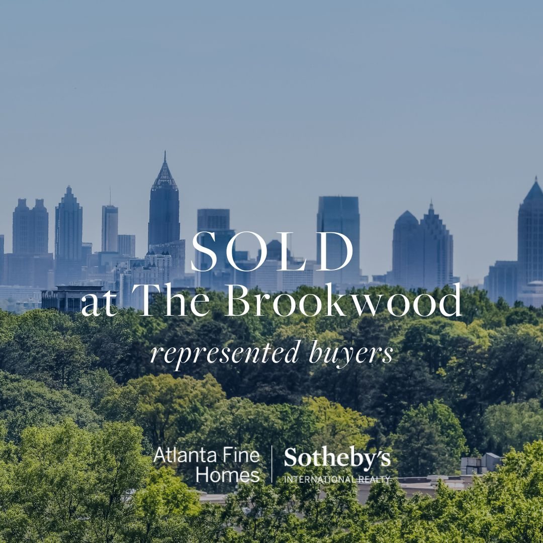 SOLD at The Brookwood post over the Atlanta skyline